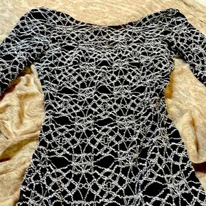 Mesh patterned dress with black dress underneath body con.